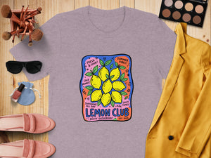 Lavender t-shirt with "Lemon Club" graphic featuring lemons and text.