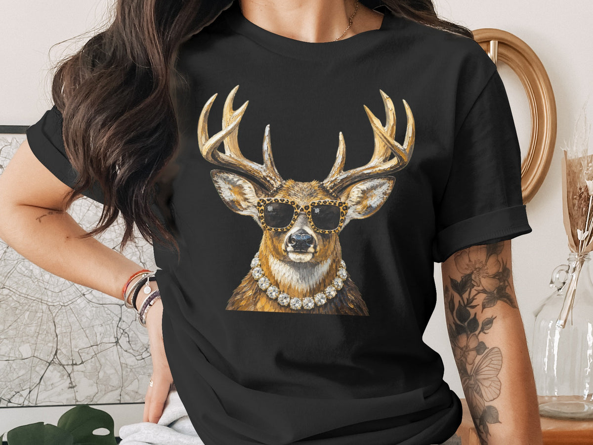 Deer with sunglasses and pearl necklace graphic on black t-shirt.