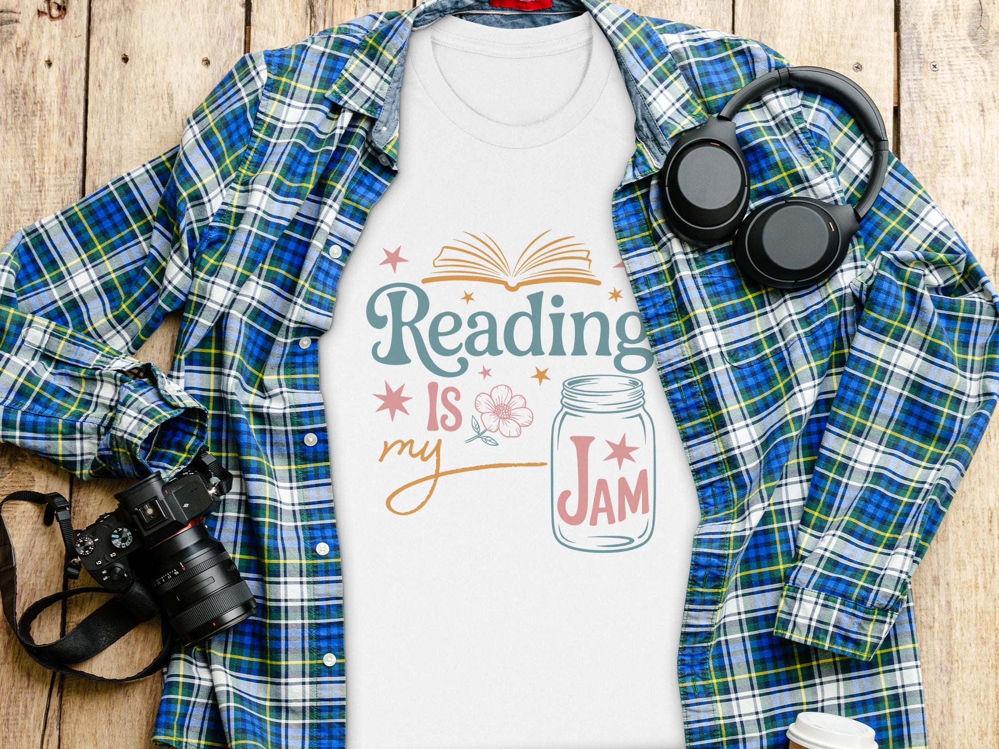 White t-shirt with "Reading is my Jam" graphic and plaid shirt.