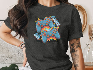 T-shirt with cartoon video game controllers and the word "GAME".