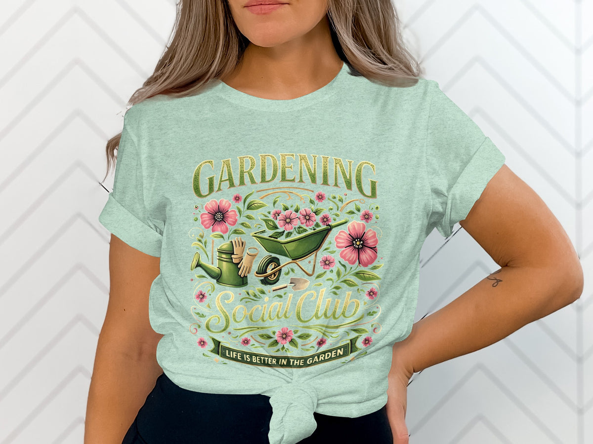 Gardening Social Club t-shirt with watering can, wheelbarrow, gloves, and flowers.