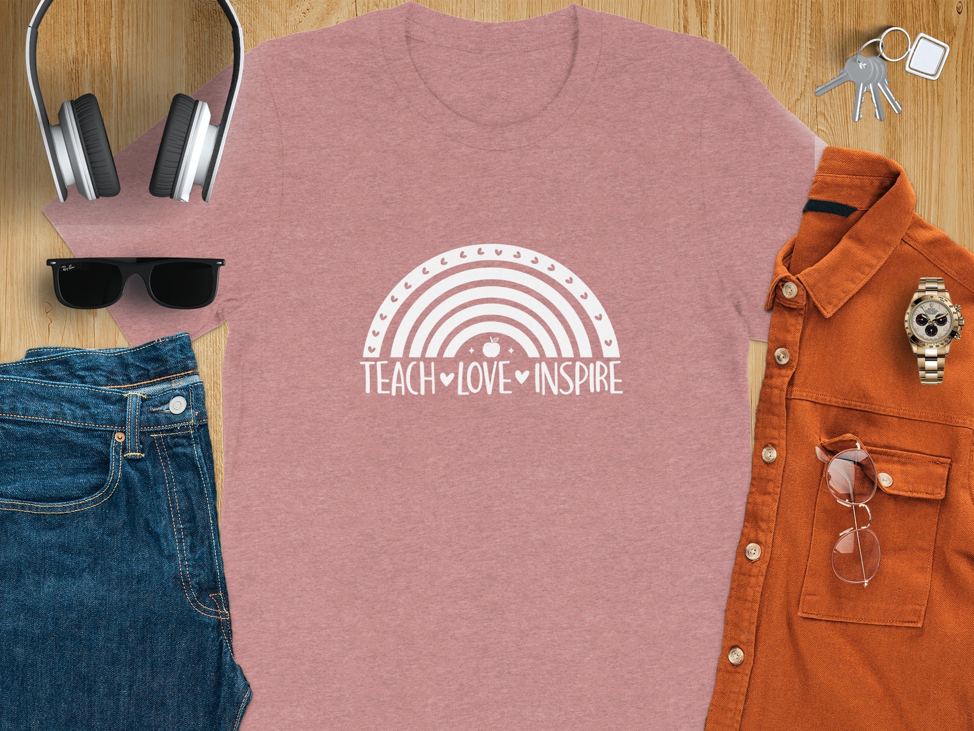 Pink t-shirt with "Teach Love Inspire" and rainbow graphic.