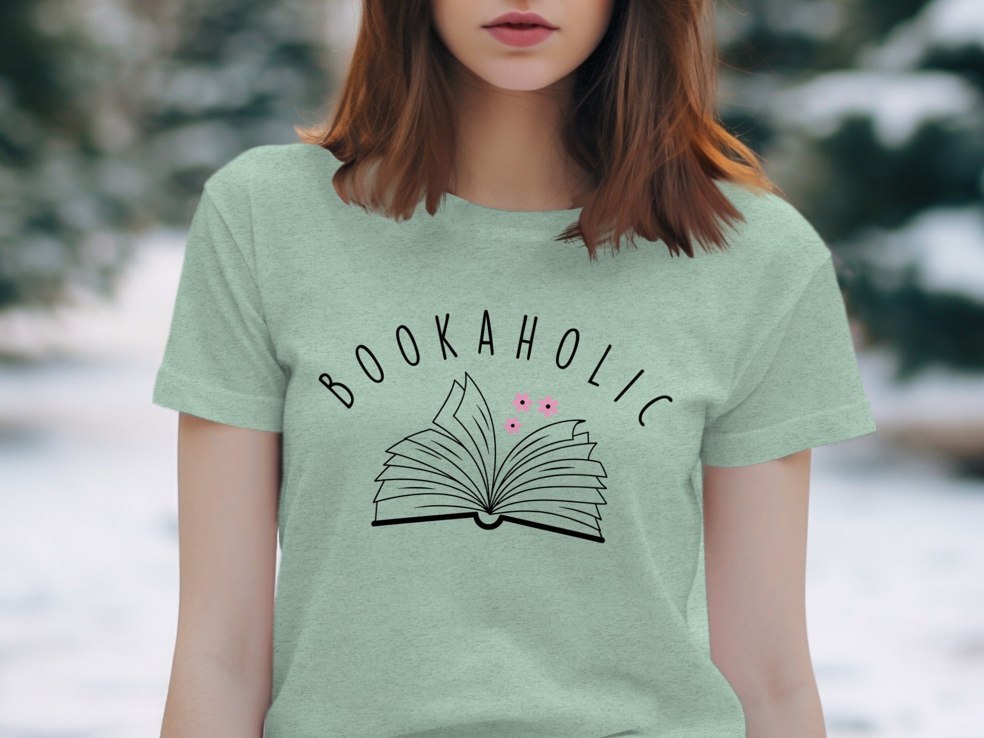 Light green t-shirt with "BOOKAHOLIC" text and an open book design.