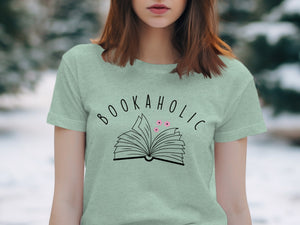 Light green t-shirt with "BOOKAHOLIC" text and an open book design.