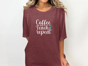 Maroon t-shirt with white text "Coffee Teach repeat" and a coffee cup icon.