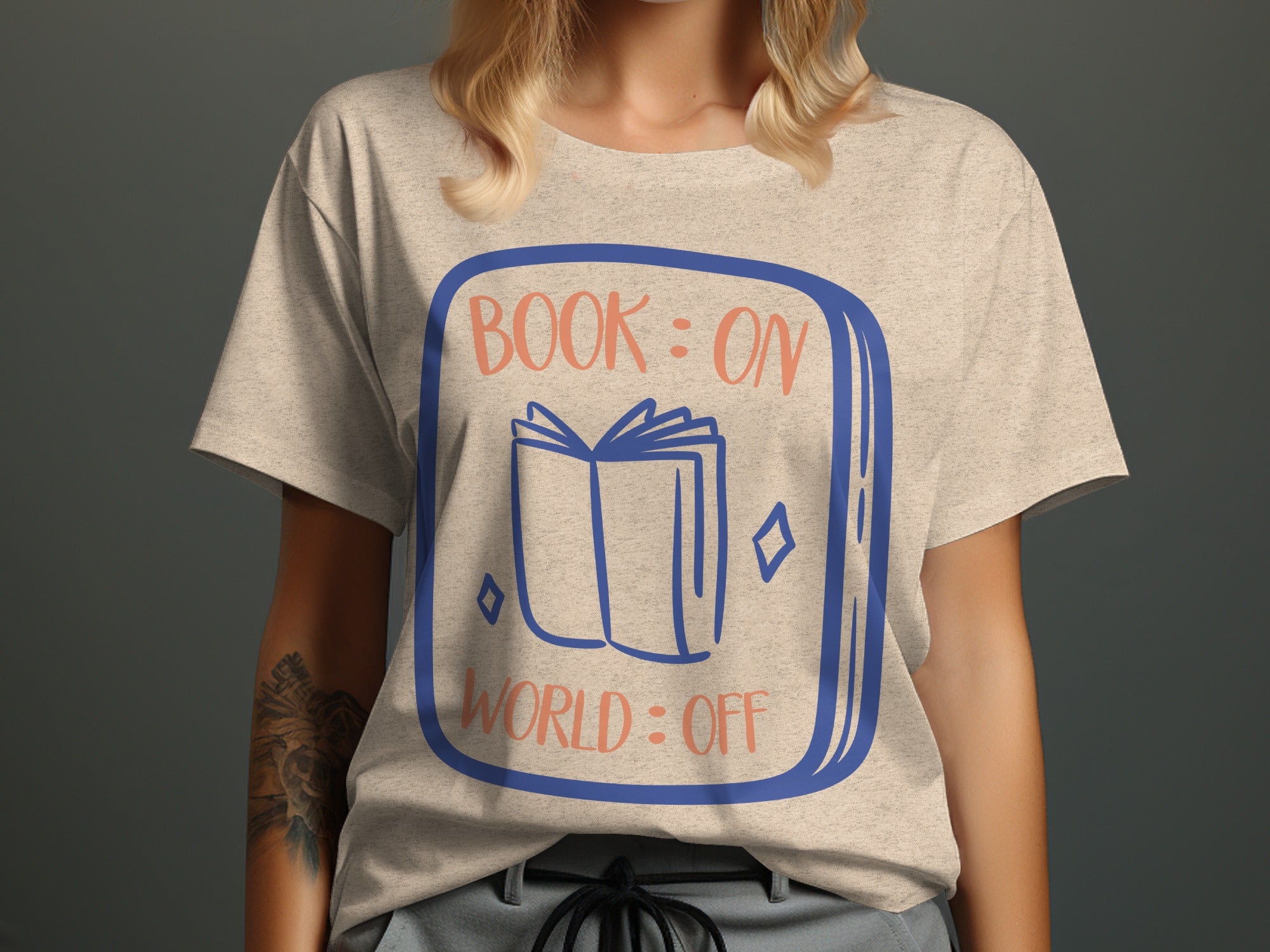 T-shirt graphic: open book, text "BOOK: ON WORLD: OFF" in blue and orange.