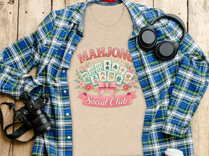 Mahjong Social Club graphic on a t-shirt with mahjong tiles and flowers.
