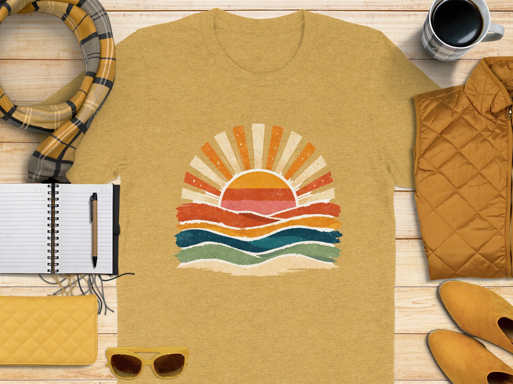 Mustard yellow t-shirt with retro sun and wave graphic print.