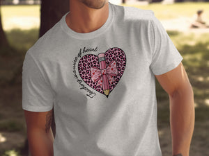 Grey t-shirt with a pink leopard print heart graphic and pencil that reads "Teaching is a wire of heart."