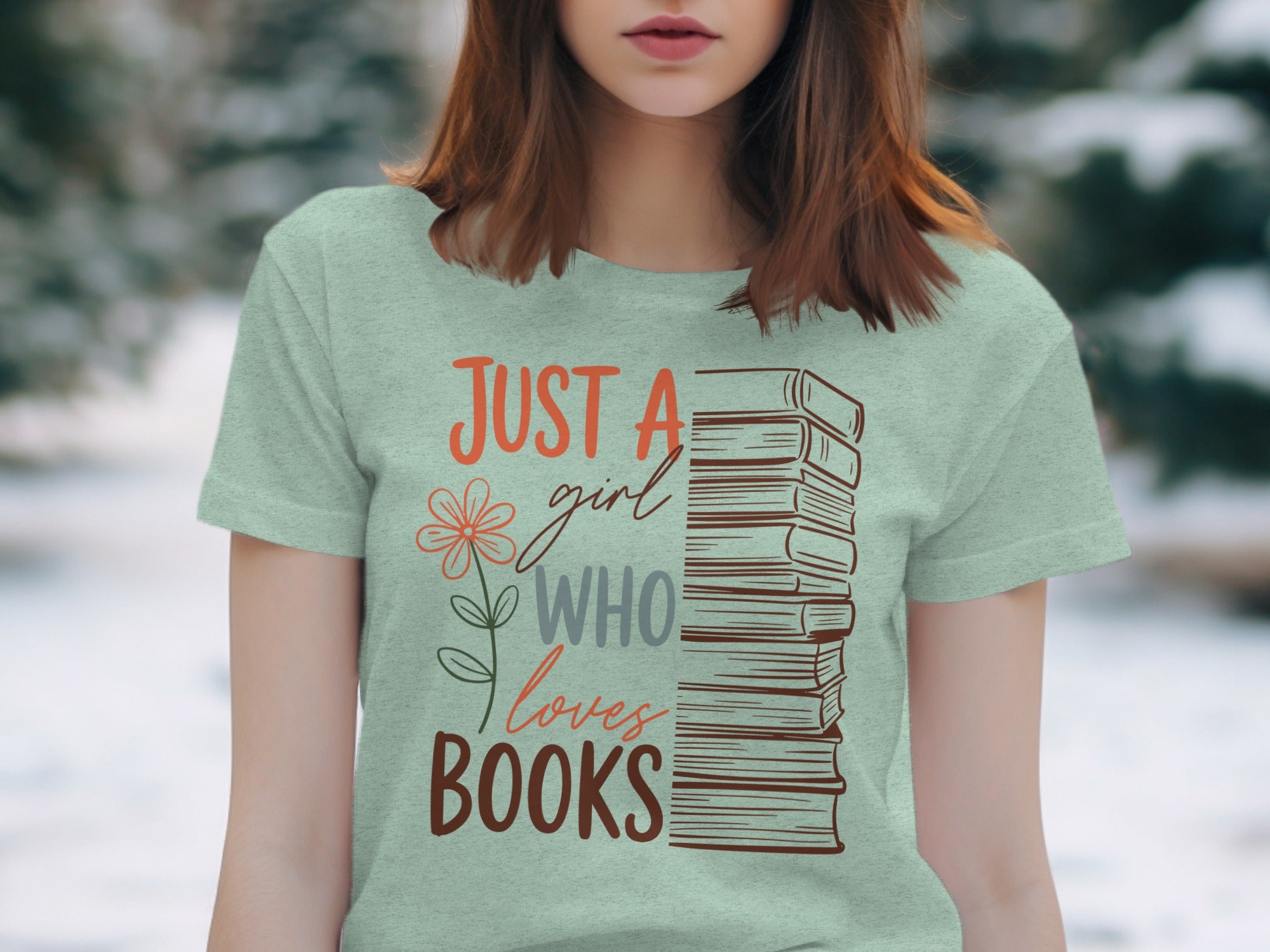 Light green t-shirt with stacked books graphic and text: "JUST A girl WHO loves BOOKS".