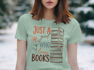 Light green t-shirt with stacked books graphic and text: "JUST A girl WHO loves BOOKS".