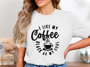 White t-shirt with "I like my coffee black as my soul" text design.