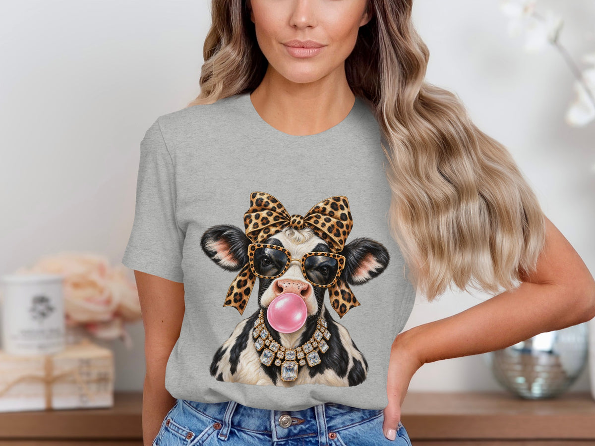 Cow wearing sunglasses, leopard bow, diamond necklace, and blowing pink bubblegum.