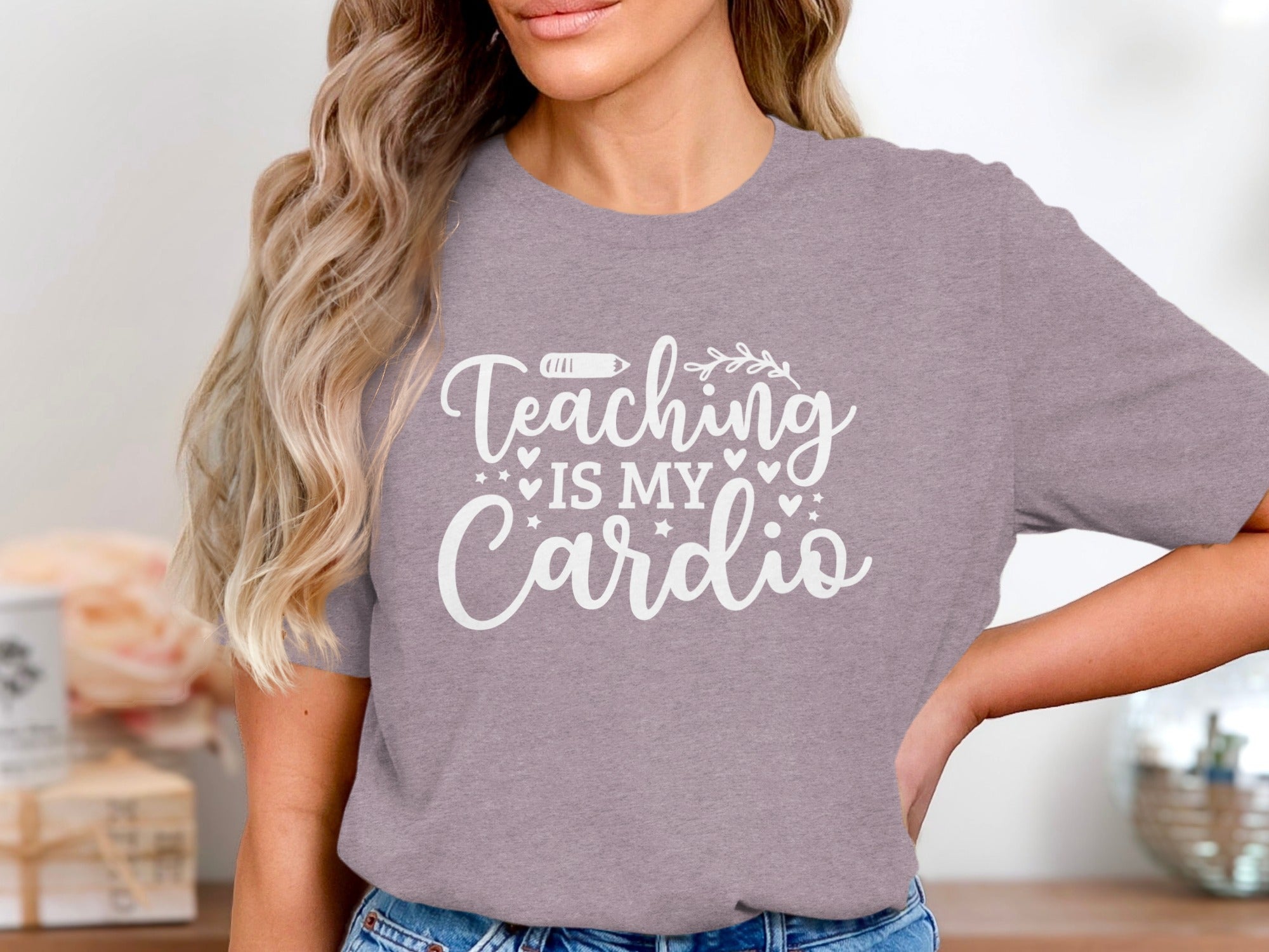 Grey t-shirt with white text "Teaching is my Cardio" and doodle accents.