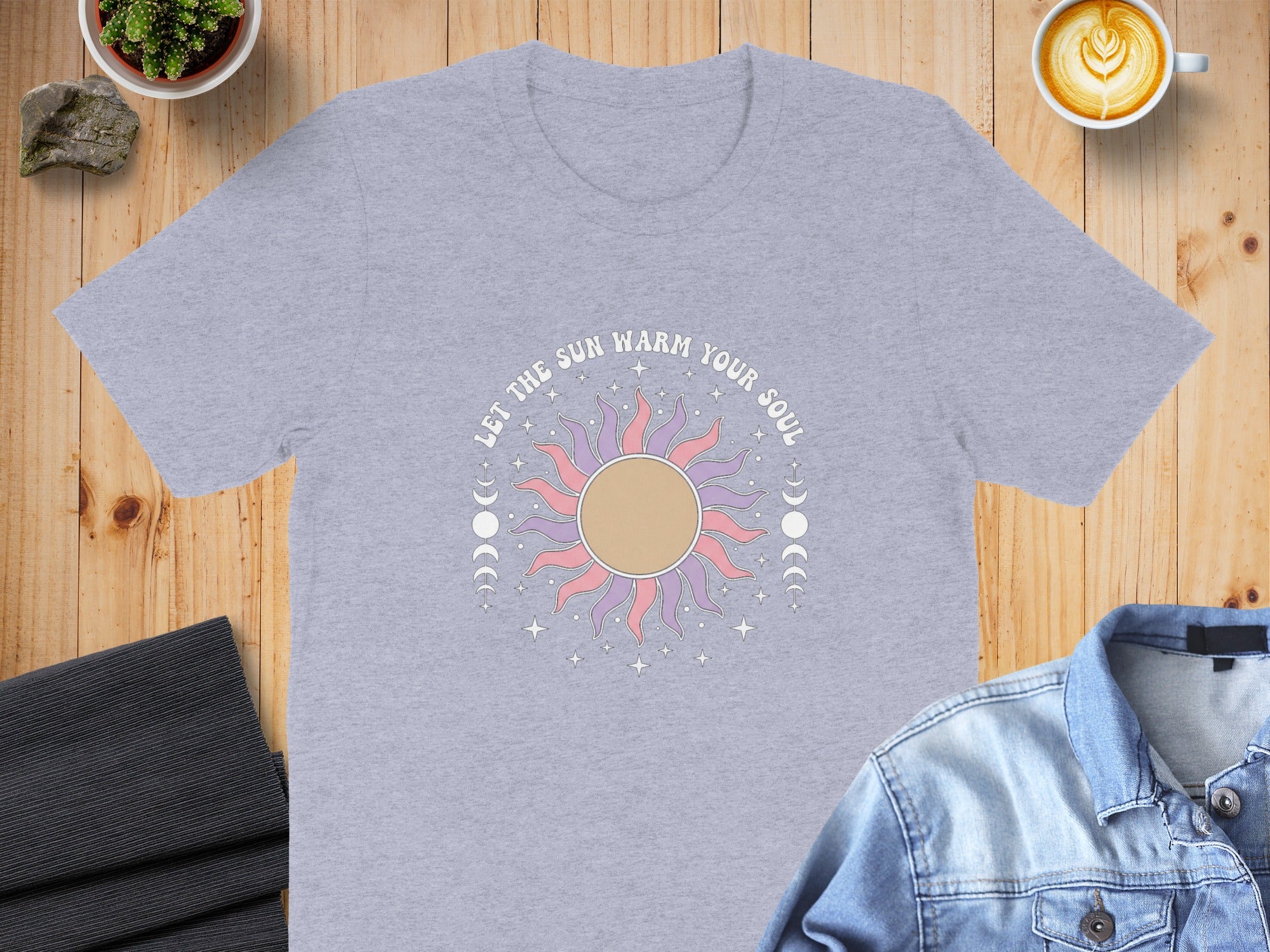 Gray t-shirt with a large sun graphic and text "LET THE SUN WARM YOUR SOUL".