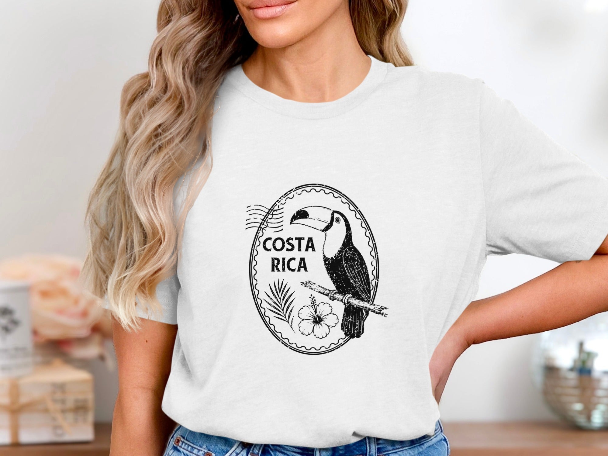 Black and white toucan illustration with "COSTA RICA" text on a white t-shirt.