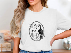 Black and white toucan illustration with "COSTA RICA" text on a white t-shirt.