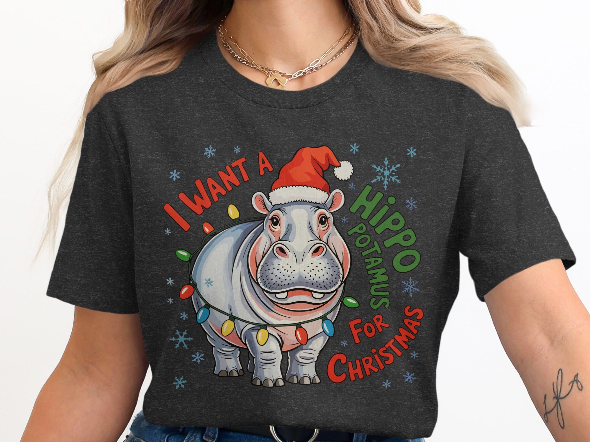 Hippo wearing Santa hat and Christmas lights, text "I want a hippopotamus for Christmas."