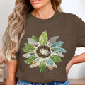 Brown t-shirt with a watercolor sunflower graphic featuring brick and watercolor textures.