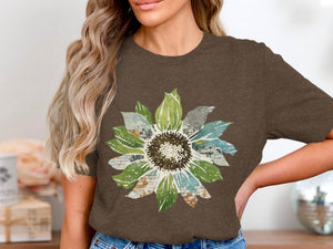 Brown t-shirt with a watercolor sunflower graphic featuring brick and watercolor textures.