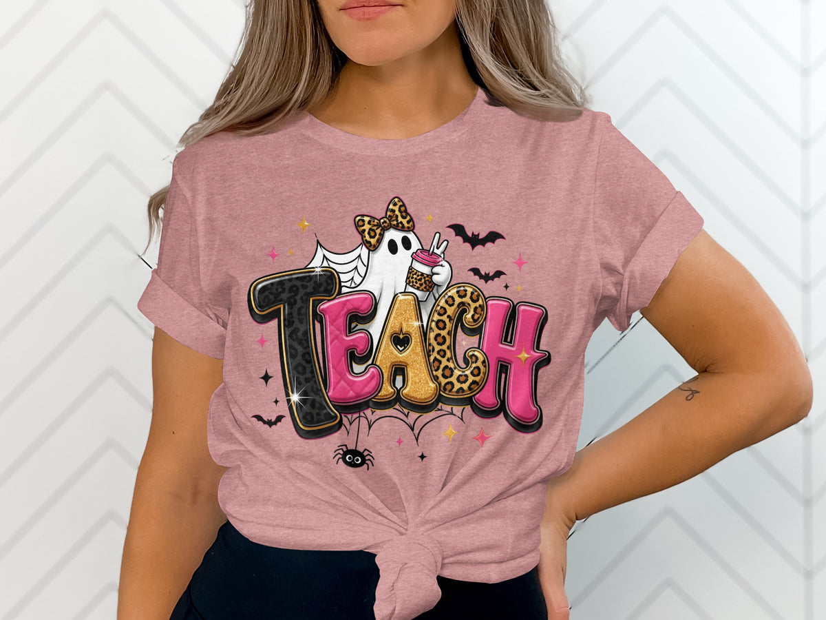 T-shirt graphic with the word "TEACH" featuring a ghost, bats, and spider.