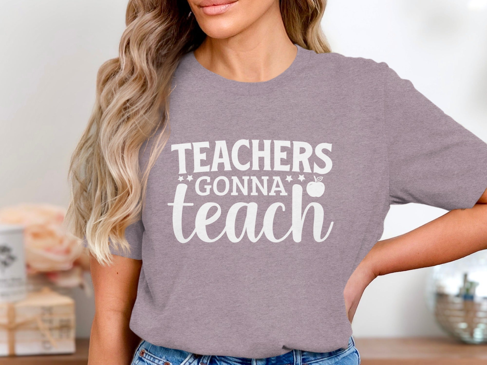 Mauve t-shirt with white text "Teachers Gonna Teach" and an apple graphic.