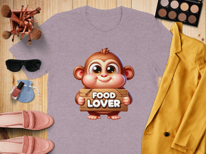 Purple t-shirt with a cartoon monkey holding a wooden sign that says "FOOD LOVER".