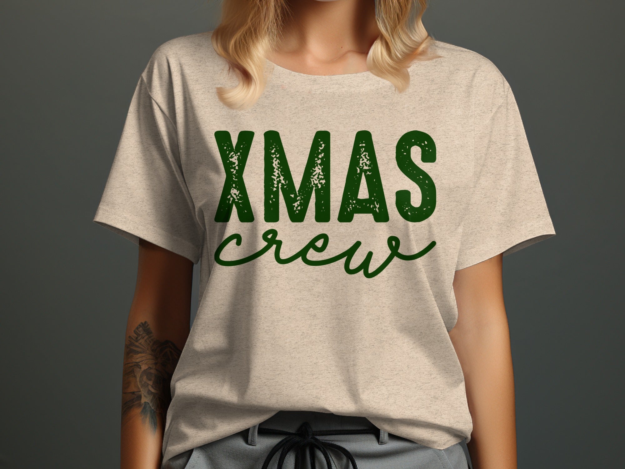 Beige t-shirt with green distressed "XMAS crew" text.