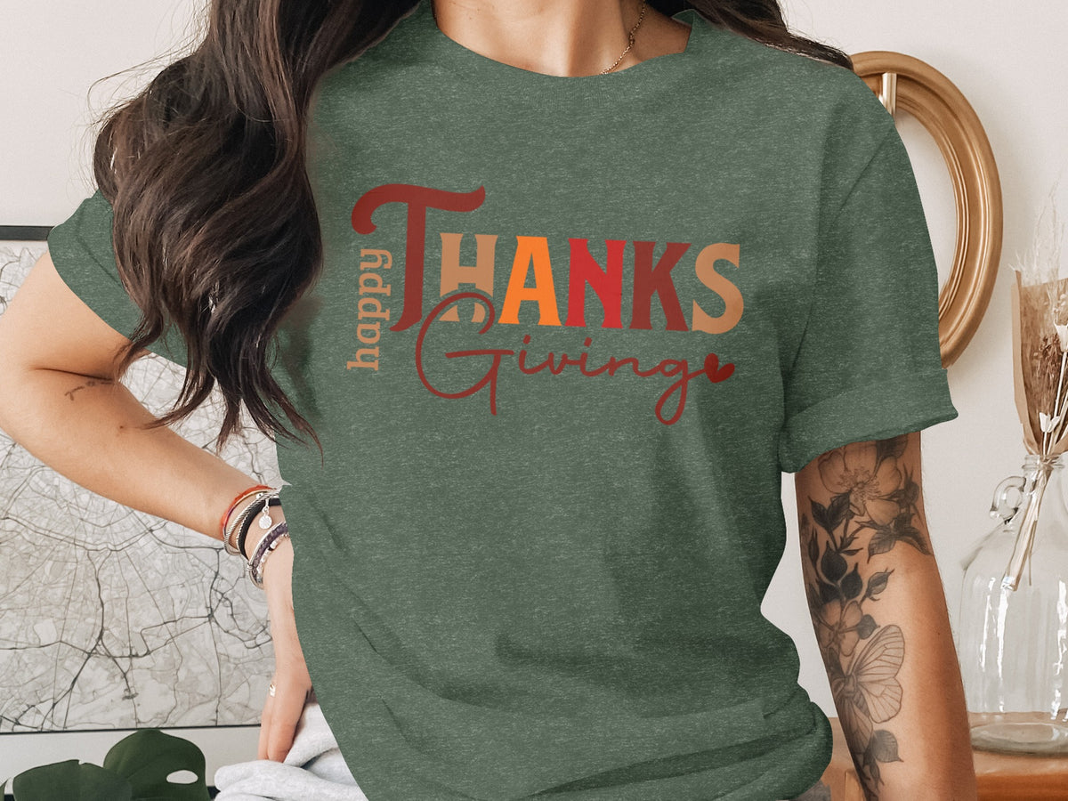 Green t-shirt with "happy THANKS Giving" text in fall colors.