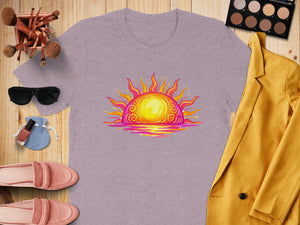Lavender t-shirt with colorful sunrise graphic, surrounded by fashion items.