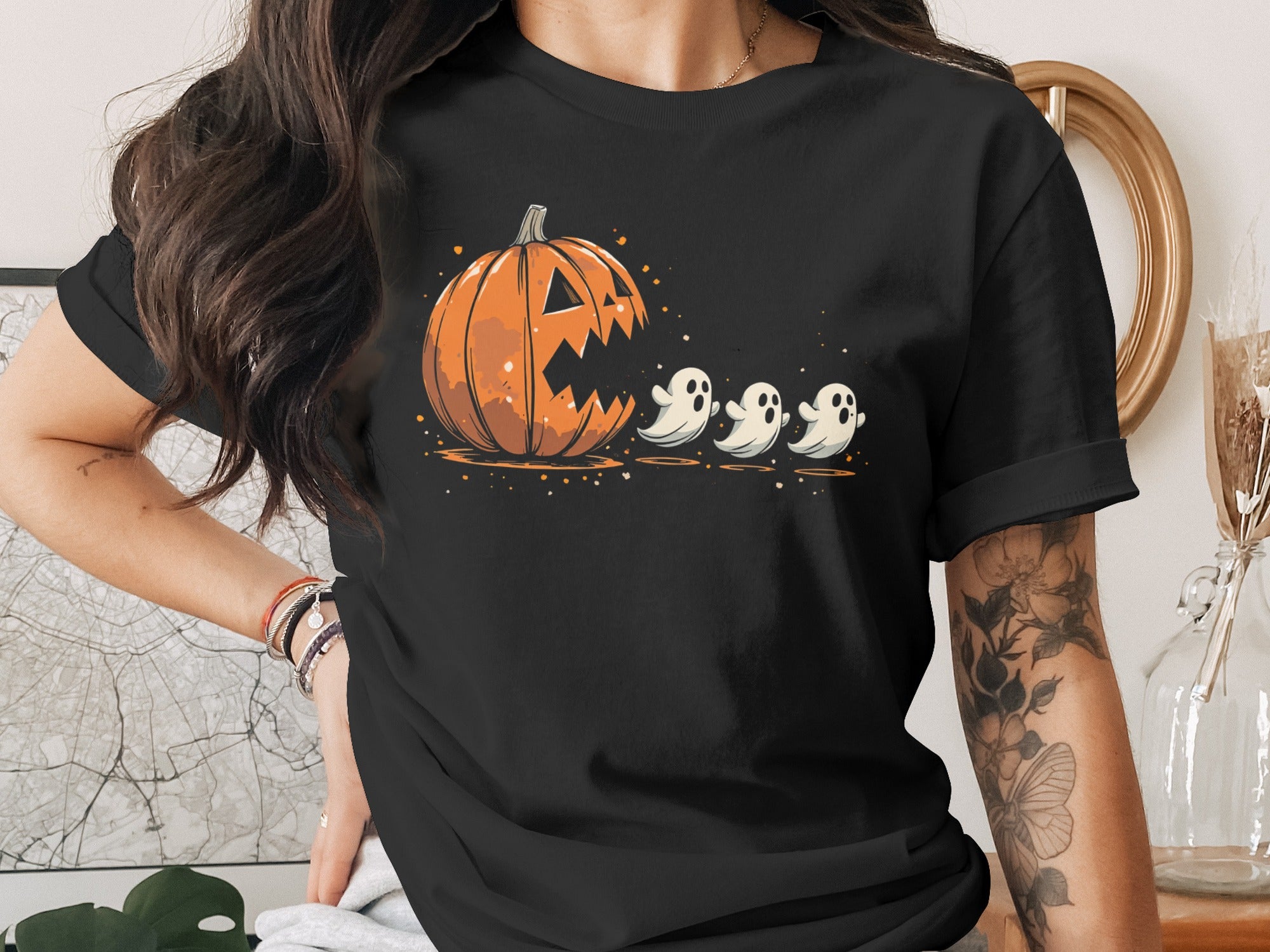 Jack-o'-lantern with three ghosts design on black t-shirt