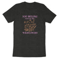 Dark t-shirt with "You Belong - among the - Wildflowers" text and delicate floral illustration.