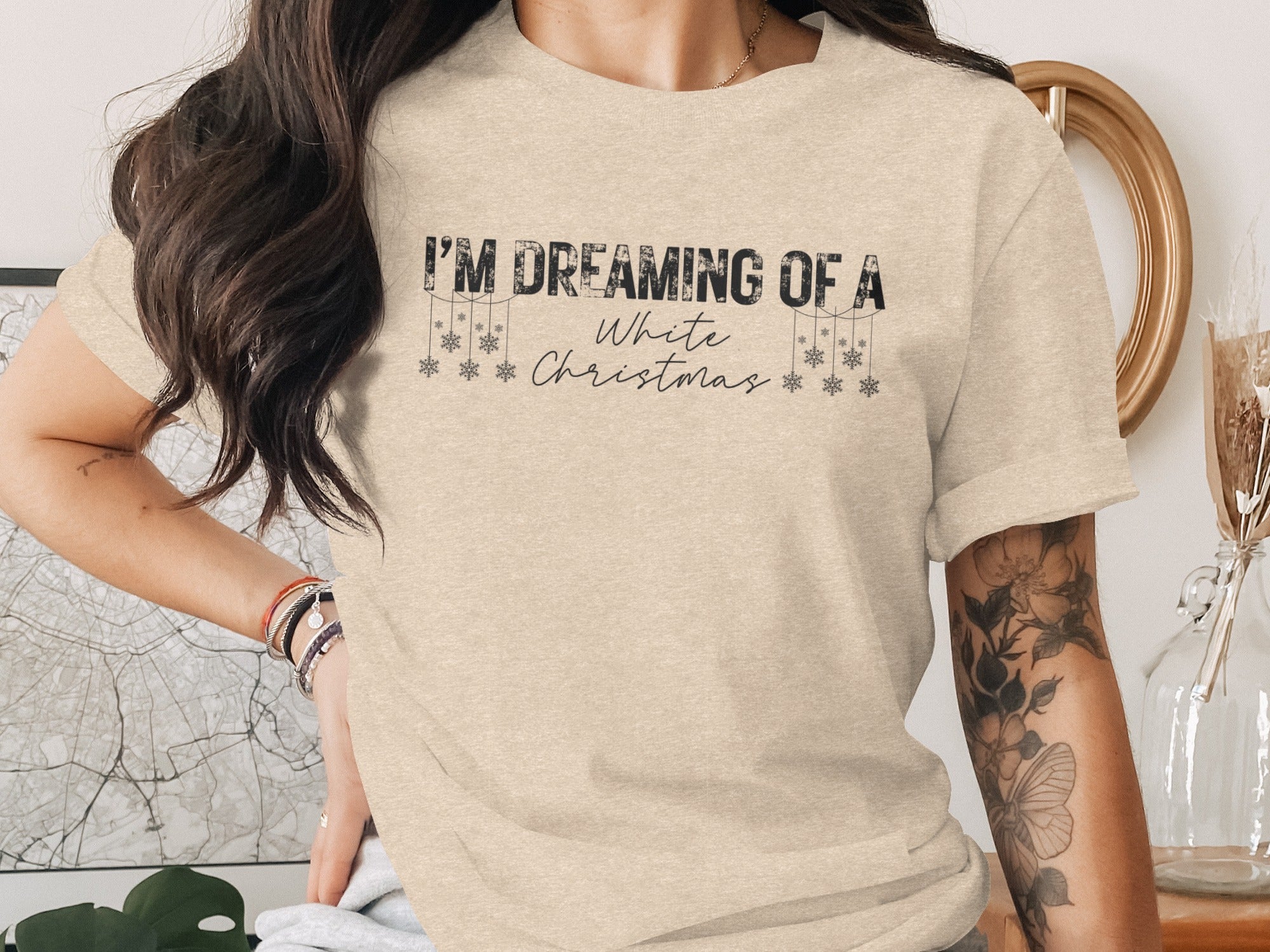 Light tan t-shirt with "I'm Dreaming of a White Christmas" text and snowflakes.