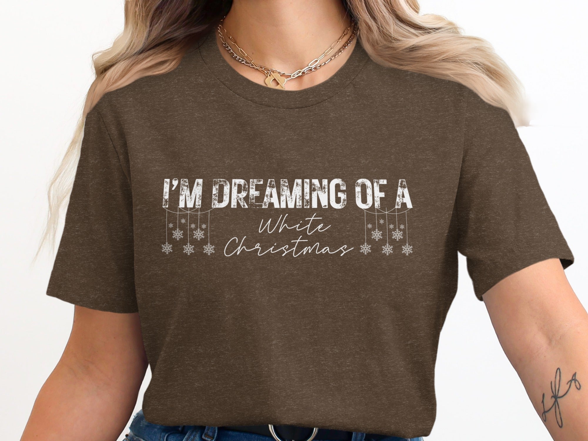 Brown t-shirt with "I'M DREAMING OF A White Christmas" text and snowflakes.