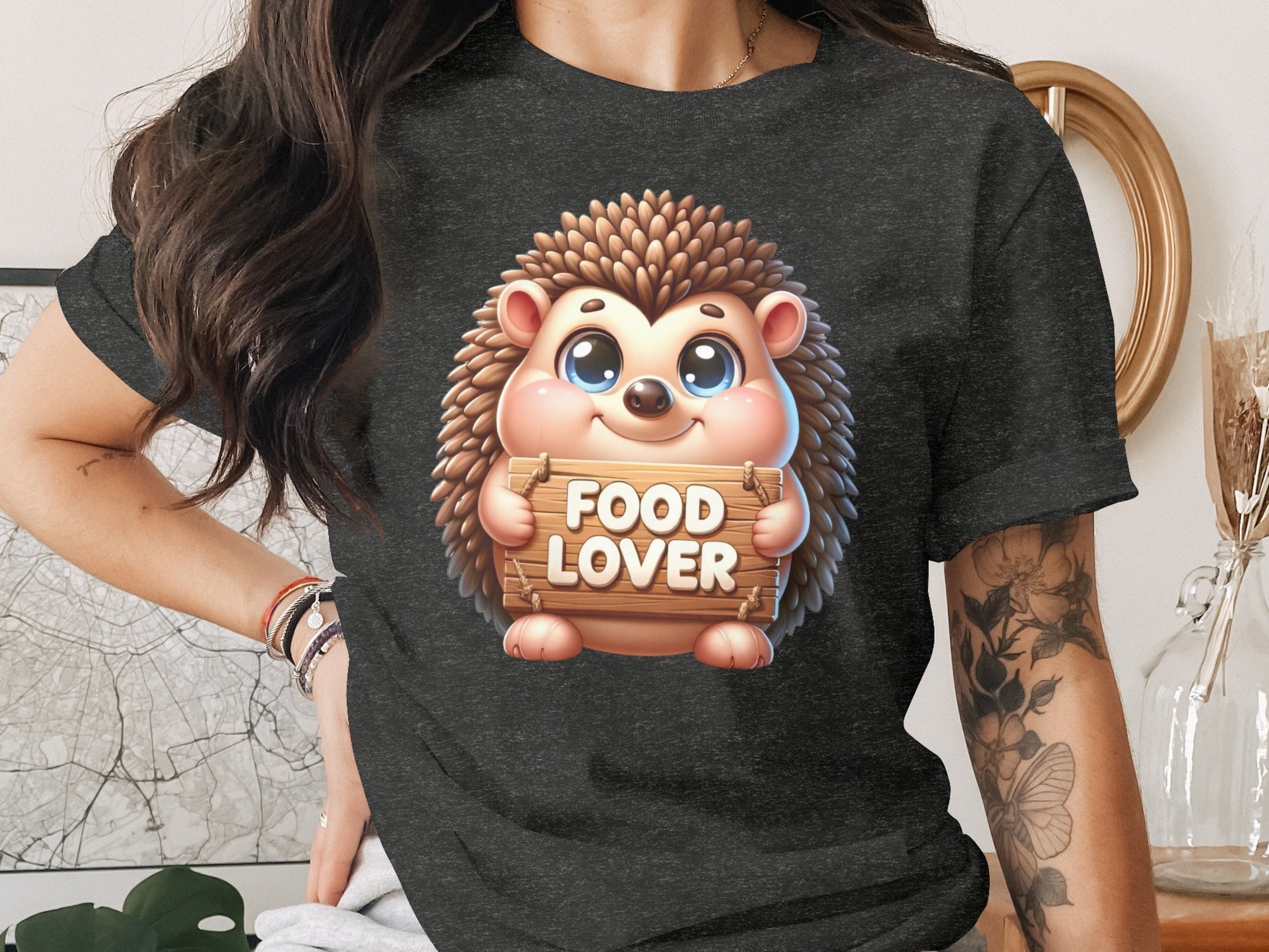 Cute hedgehog graphic with "FOOD LOVER" text on a dark t-shirt.