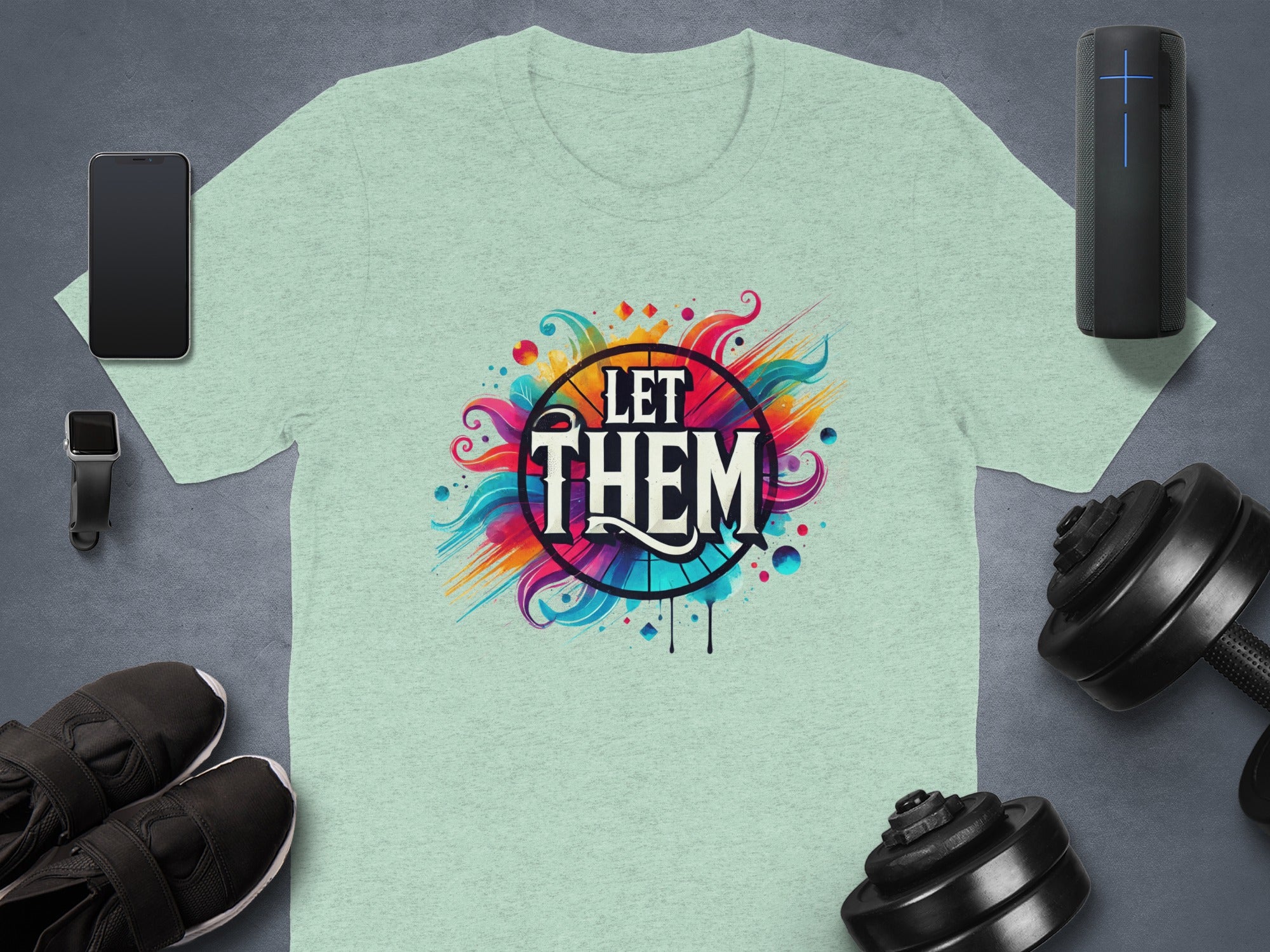 Light green t-shirt with "LET THEM" text and colorful abstract design.