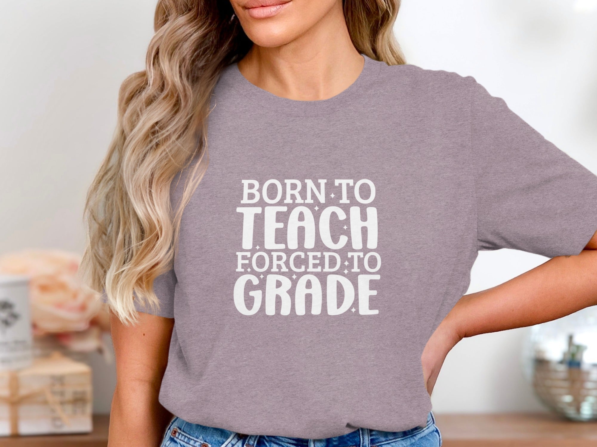 T-shirt with white text "BORN TO TEACH FORCED TO GRADE".
