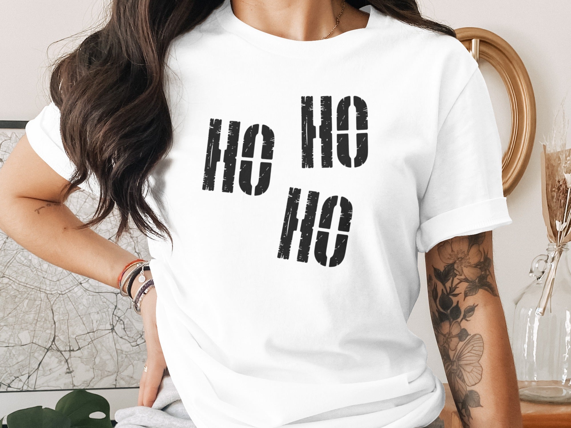 White t-shirt with black stencil-style "Ho Ho Ho" text.