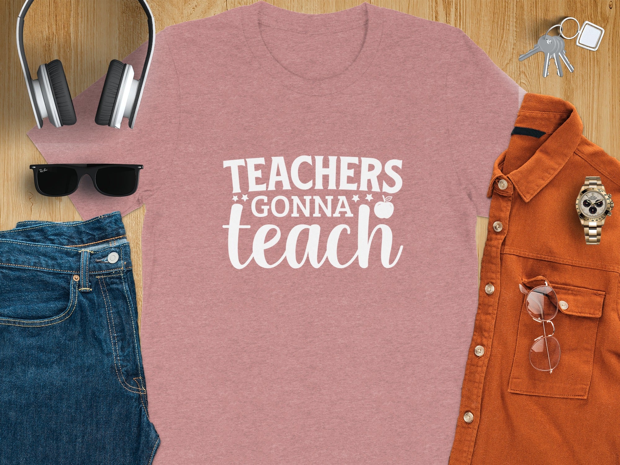 Dusty rose t-shirt with white text that reads "TEACHERS GONNA teach".