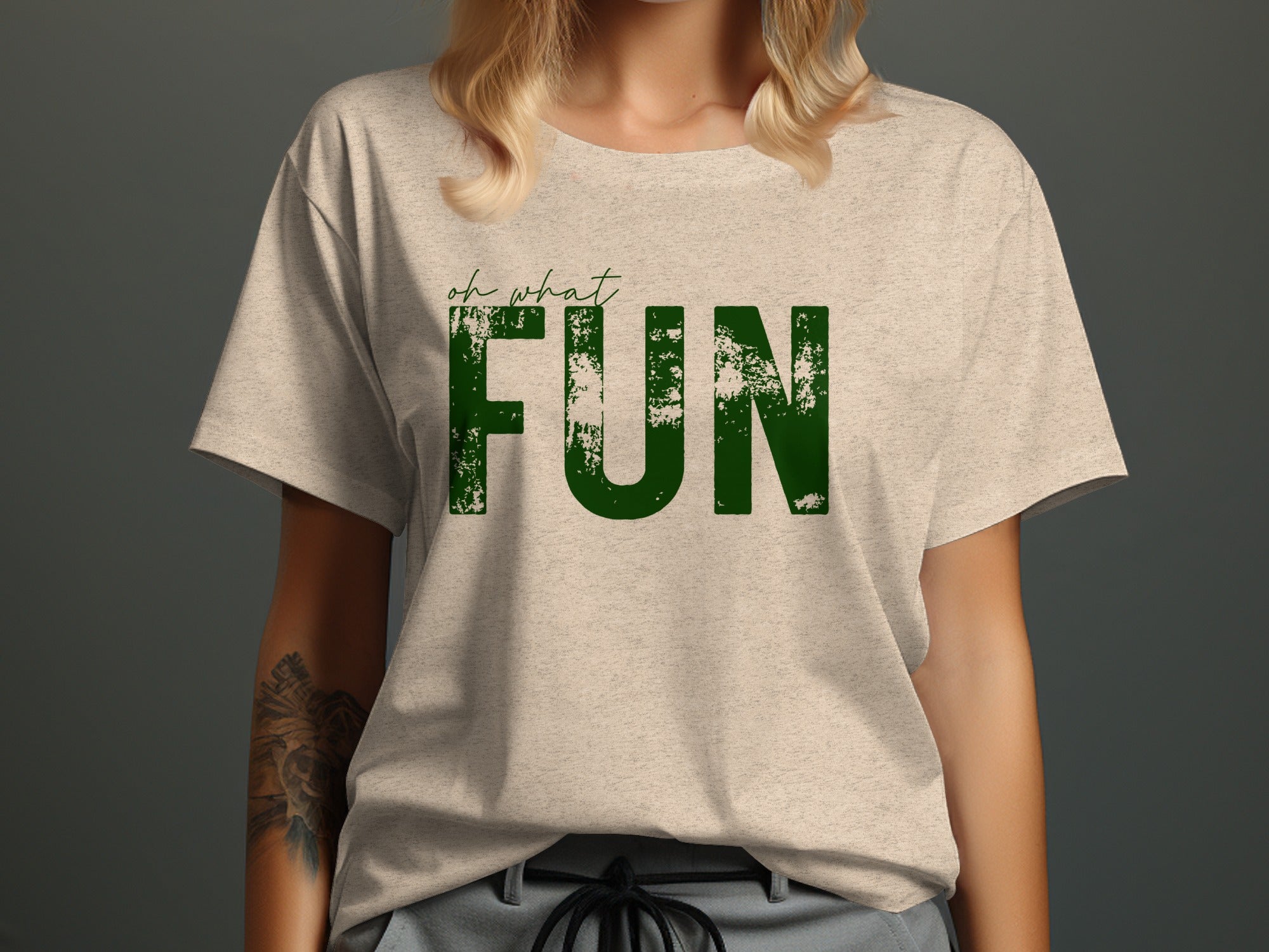 Light tan t-shirt with green "oh what FUN" text.
