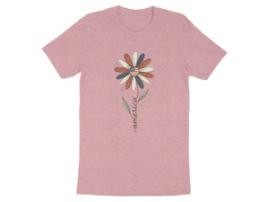 Pink t-shirt with a flower graphic featuring the American flag and the word "America".