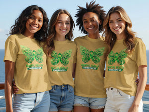 Four women wear tan t-shirts with a green butterfly design and "Mental Health Awareness" text.