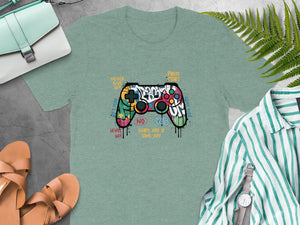 T-shirt with graphic of a graffiti-styled controller and gaming phrases.