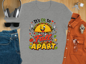 Gray t-shirt with cartoon taco graphic reading "It's Ok to Fall Apart".