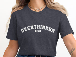 Dark gray t-shirt with "OVERTHINKER 24/7" text in white distressed lettering.