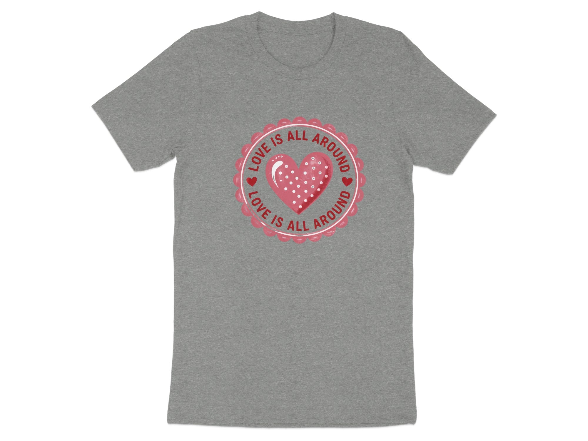 Grey t-shirt with a circular graphic of a pink heart and text "LOVE IS ALL AROUND".