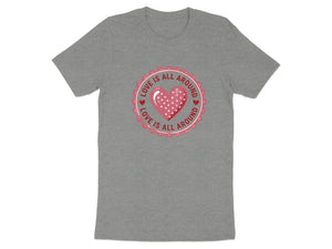 Grey t-shirt with a circular graphic of a pink heart and text "LOVE IS ALL AROUND".