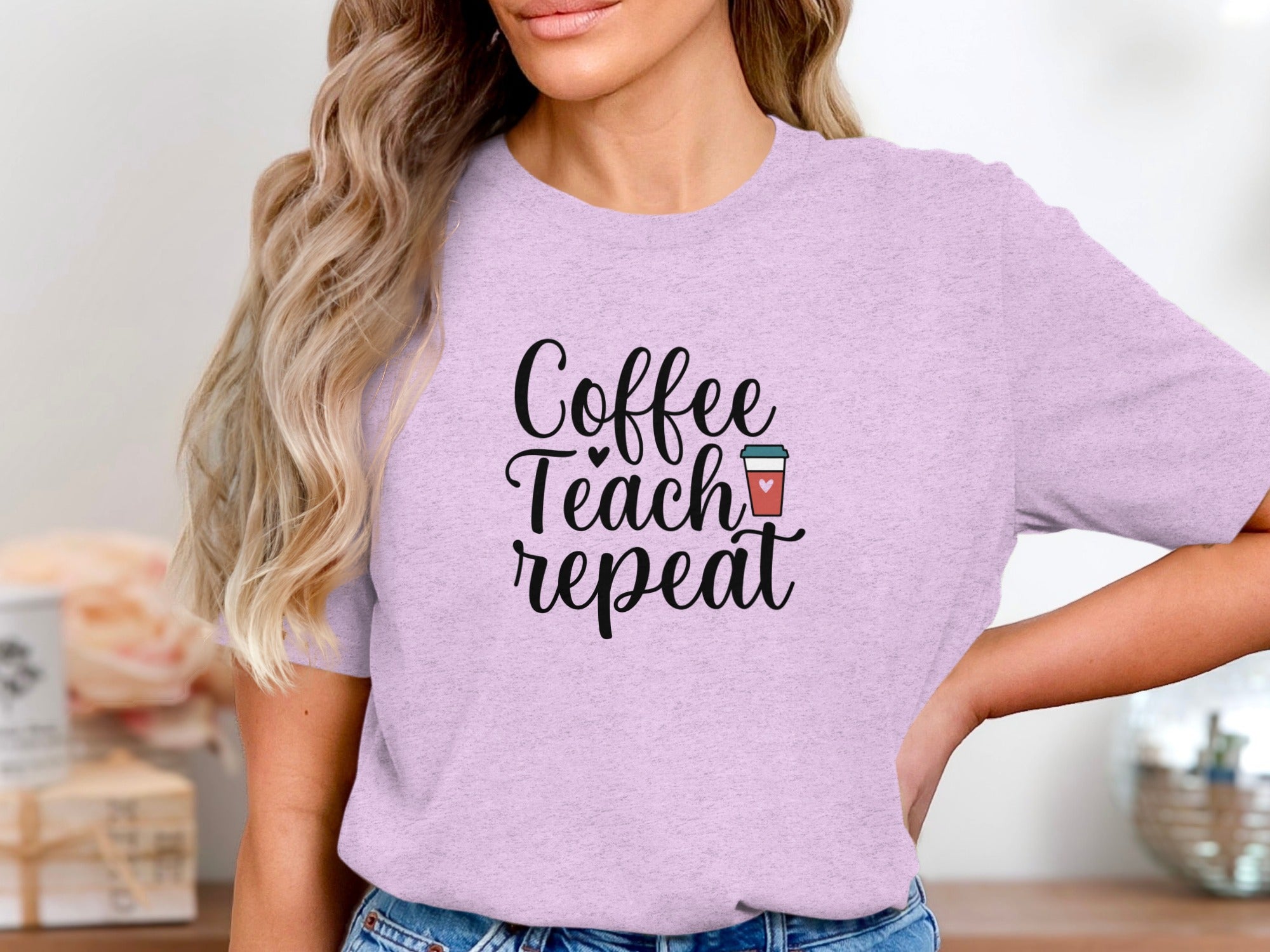 Lilac t-shirt with black text: "Coffee Teach repeat" and a coffee cup.