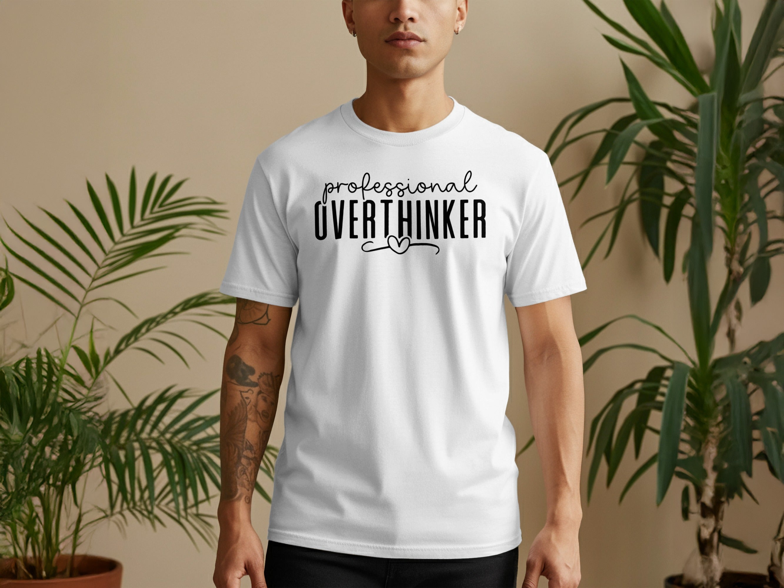 White t-shirt with black text reading "professional OVERTHINKER" and a heart.