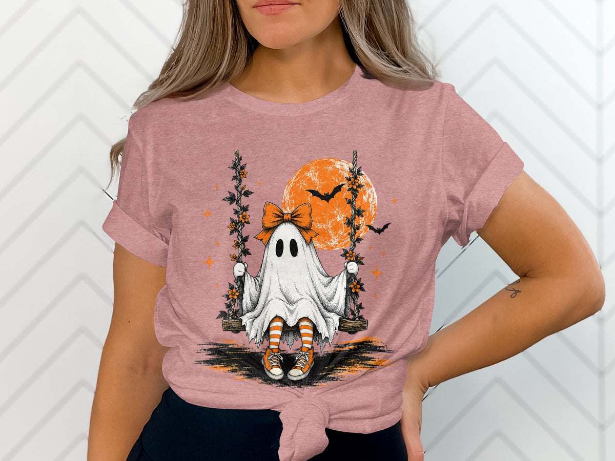 Ghost on swing with orange moon, bats, and stars, wearing striped socks.
